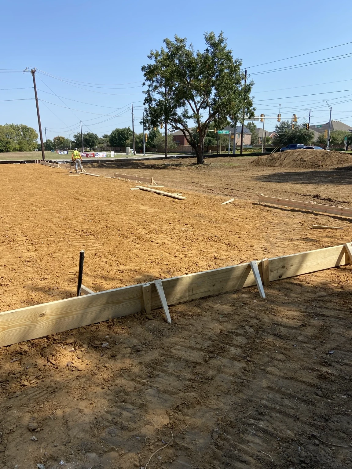 Graded subgrade and timber forms at a Vortex concrete jobsite